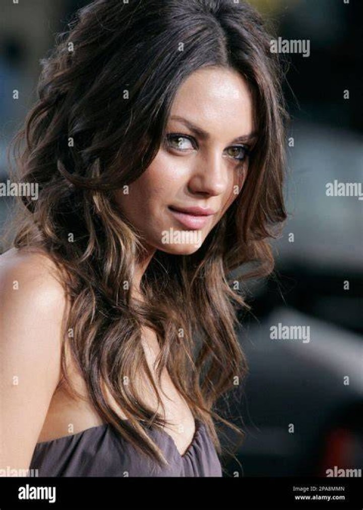 Actress Mila Kunis poses for a portrait at a bowling alley in Hollywood, California, in 2006 | Source: Getty Images