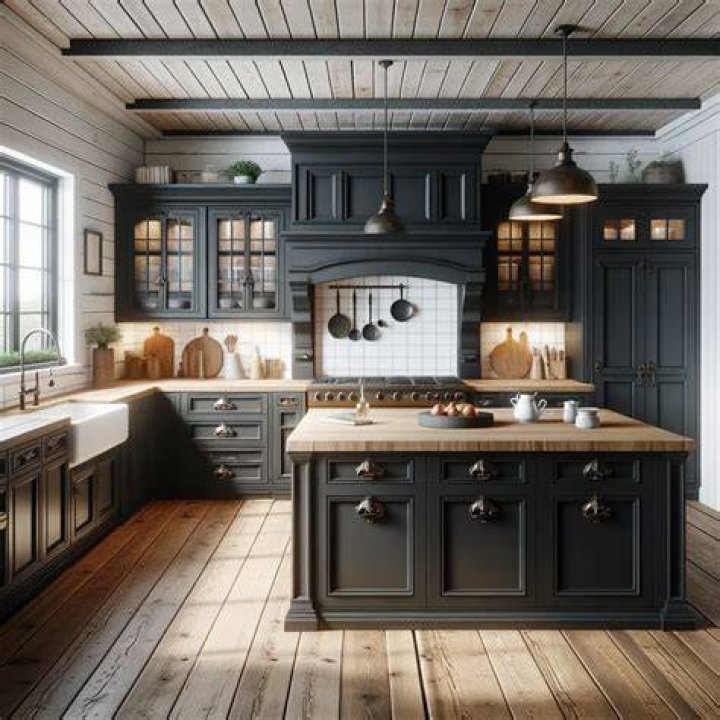 black kitchen featuring a farmhouse sink