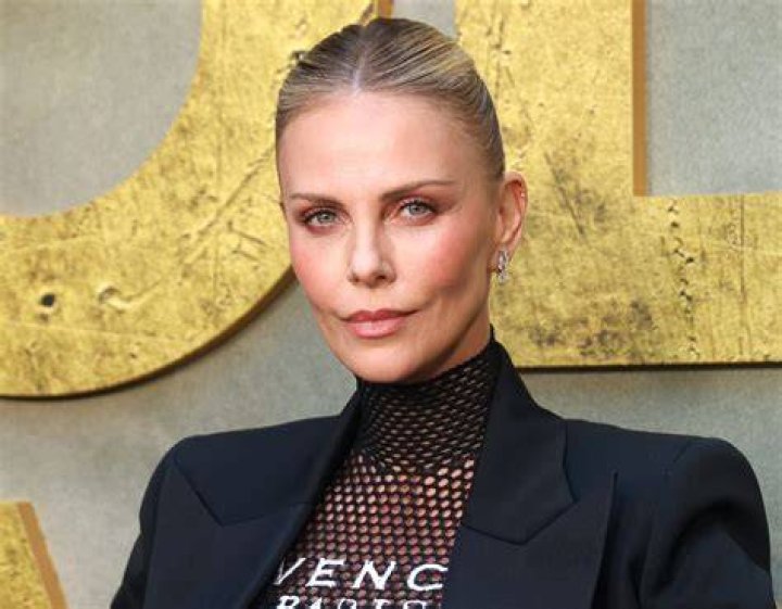 Charlize Theron looks chic as ever after hair transformation as she attends the Dior fashion show in Paris