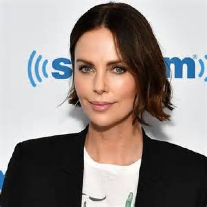 Charlize Theron stuns as she channels Elizabeth Hurley in show-stopping split dress