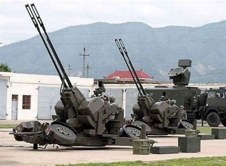 Chinese anti-aircraft batteries take part in military drills aimed at intimidating Taiwan, which it claims belongs to it