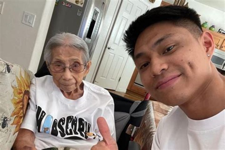 Chris Punsalan combs his grandma's hair. | Source: 