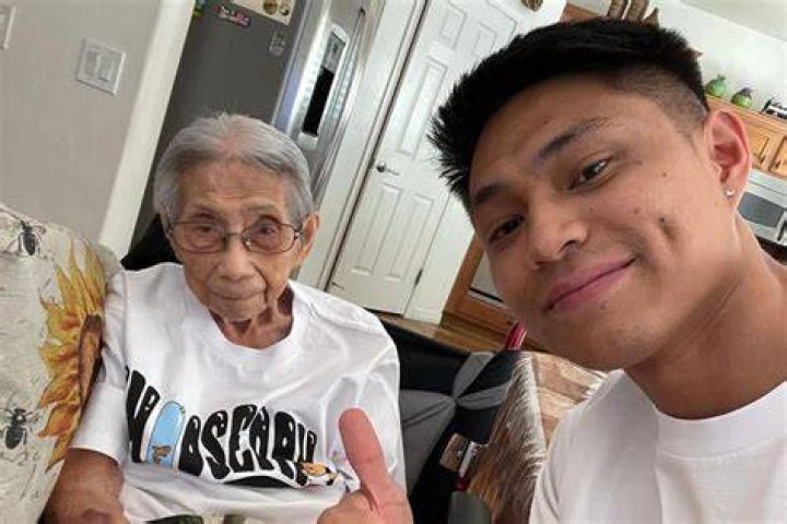 Chris Punsalan helps his grandma brush her teeth. | Source: 