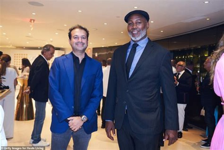 Dapper: Kamal Hotchandani and Lennox Lewis both cut dapper figures in blue suits