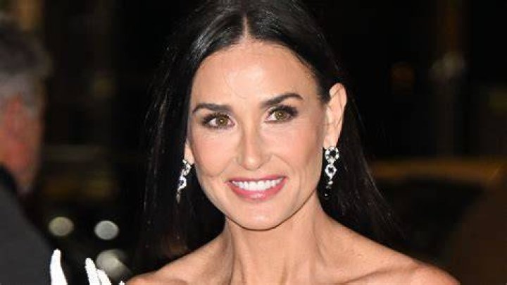 Demi Moore, 61, looks ageless in strapless pinstripe co-ord