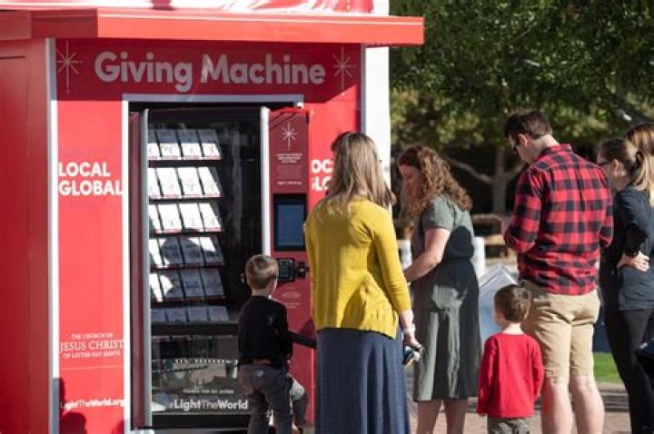 Families begin picking out items to donate at the Giving Machine in Gilbert, Arizona.