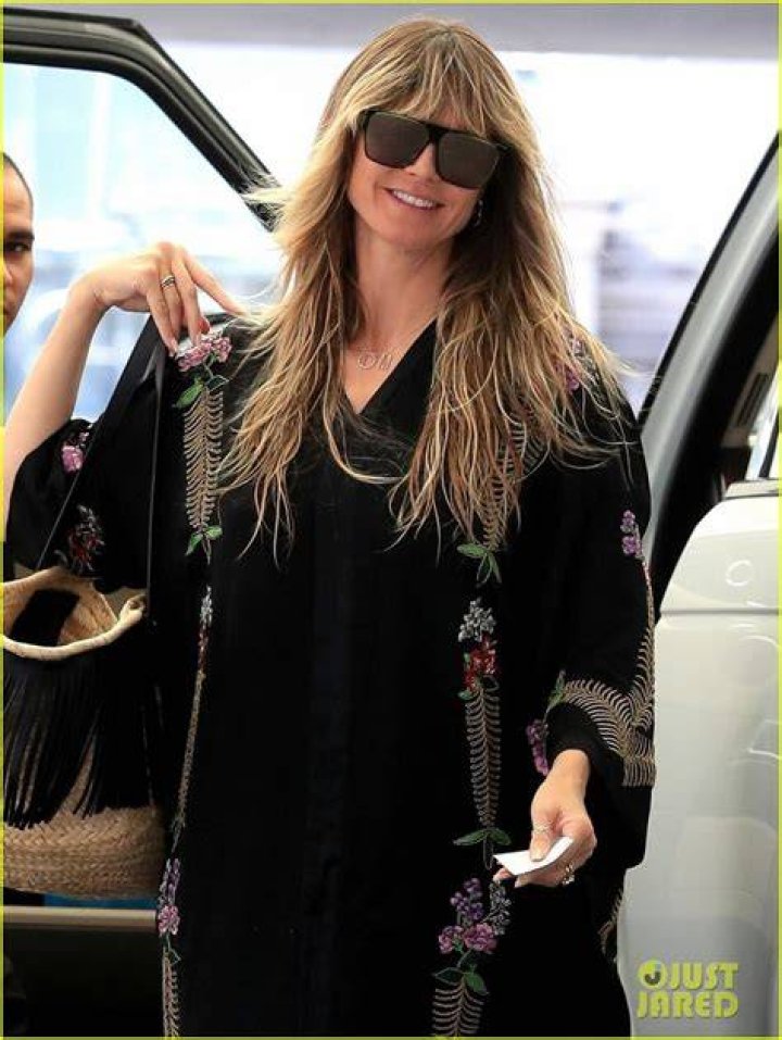 Heidi Klum shows off her supermodel legs in sheer mini dress