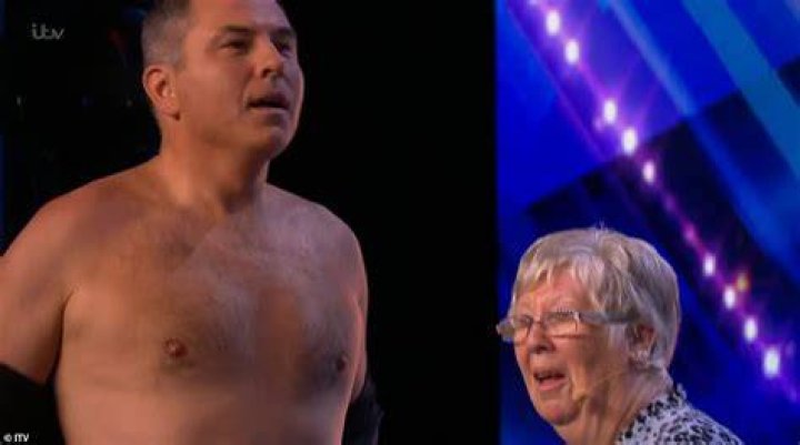 Hysterical: David Walliams hilariously ripped open his shirt as he joined a dancing 'granny' on stage during her Britain's Got Talent audition on Sunday