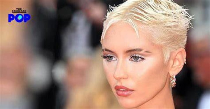Iris Law with eyebrow slits and short platinum hair 