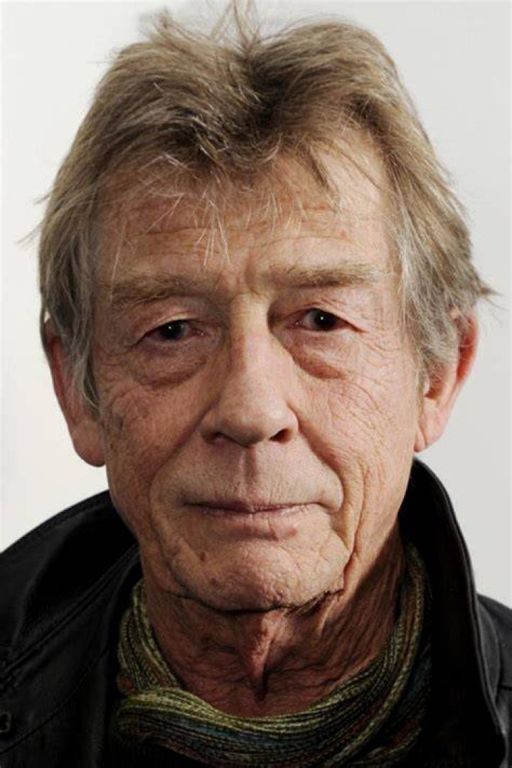 John Hurt smiles at event