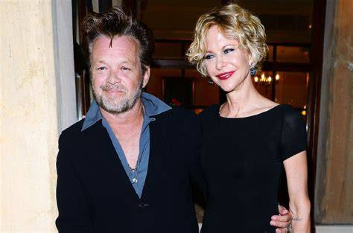 John Mellencamp and Meg Ryan at the Taormina Filmfest held at the Teatro Antico on June 20, 2013, in Italy | Photo: Venturelli/Getty Images