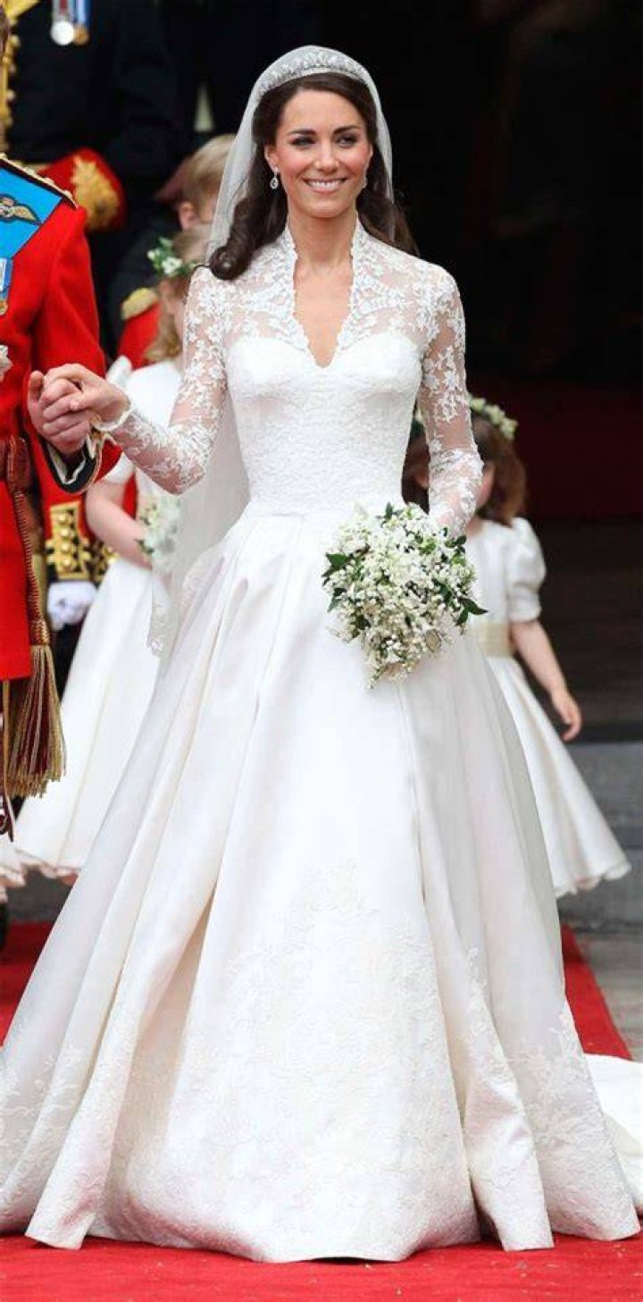 Kate in wedding dress in carriage