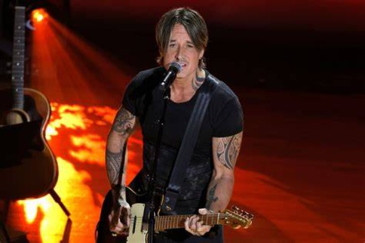 Keith Urban on stage with a guitar