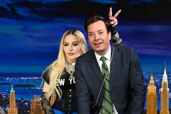 Madonna crawls onto Jimmy Fallon's desk on "The Tonight Show."
