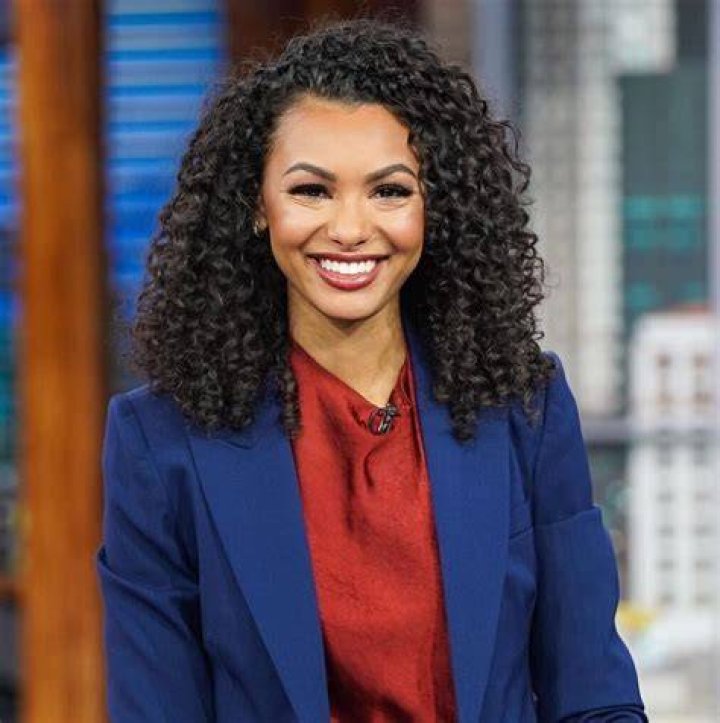 Malika Andrews pictured while she was reporting on NBA