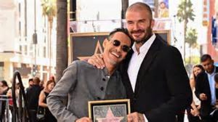 Marc Anthony stands with David Beckham as Anthony receives a star on the Hollywood Walk of Fame during a ceremony in Hollywood, California on September 7, 2023