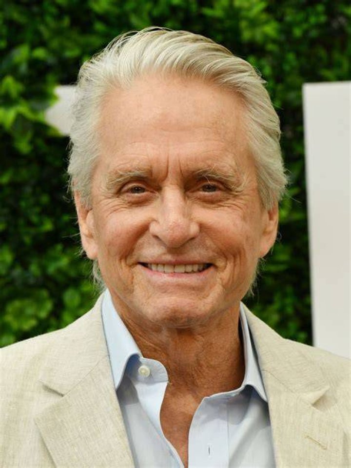 Michael Douglas' daughter Carys displays incredible curves in sultry wedding guest dress