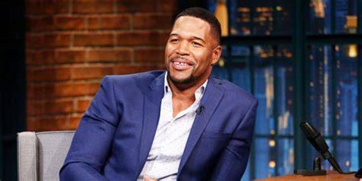 michael strahan posing with three daughter