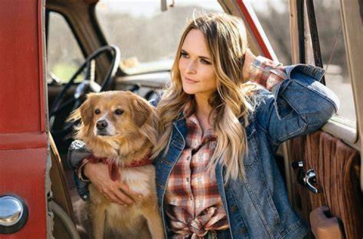 Miranda Lambert with her dog on her front porch