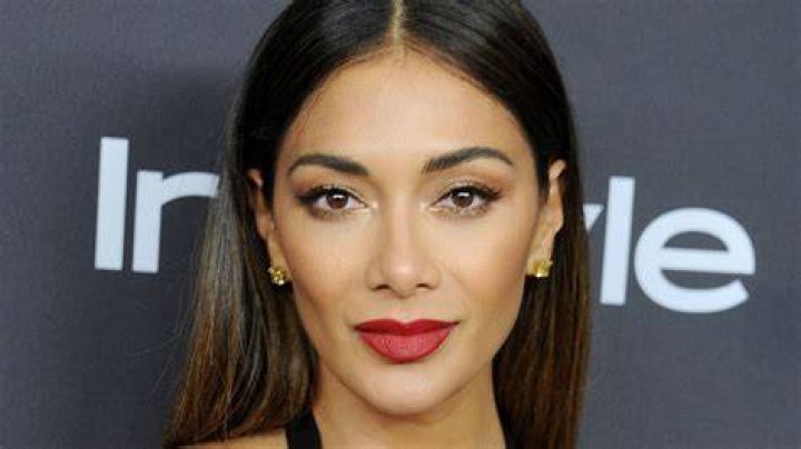 Nicole Scherzinger causes a stir in plunge leopard print bikini