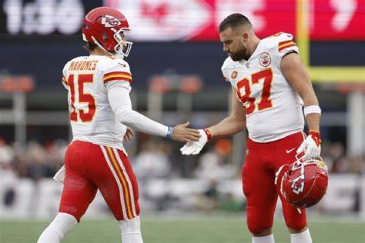 Patrick Mahomes #15 and Travis Kelce #87 of the Kansas City Chiefs celebrate after the Chiefs defeated the Las Vegas Raiders to win the game at Arrowhead Stadium on October 10, 2022 in Kansas City, Missouri