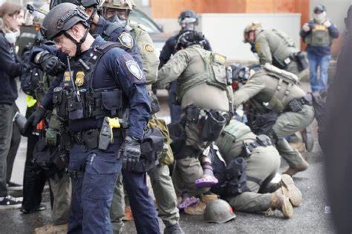Police and federal agents search an apartment in New Hampshire
