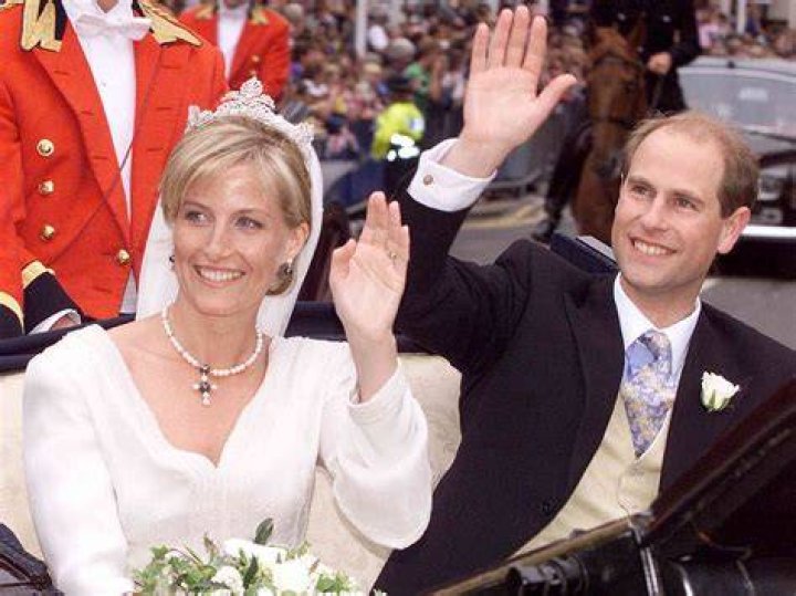 Prince Edward and Sophie wave to the crowd in carriage