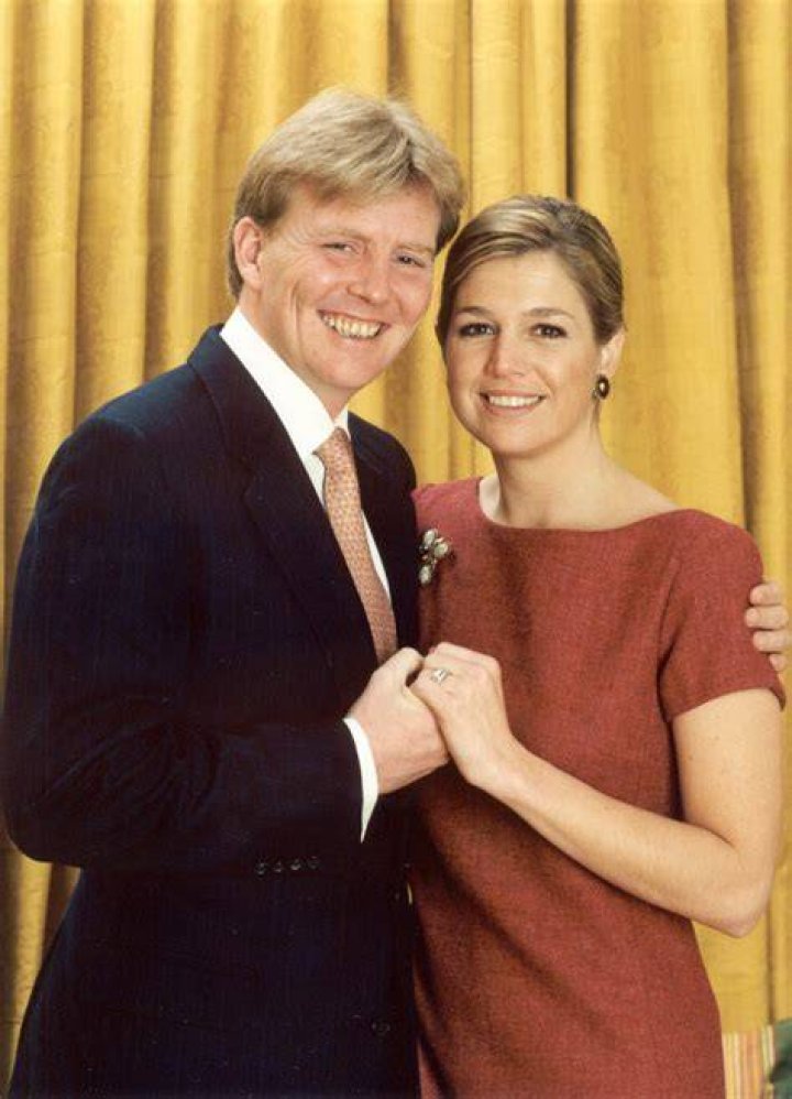 Prince Willem-Alexander and Maxima smiling at altar