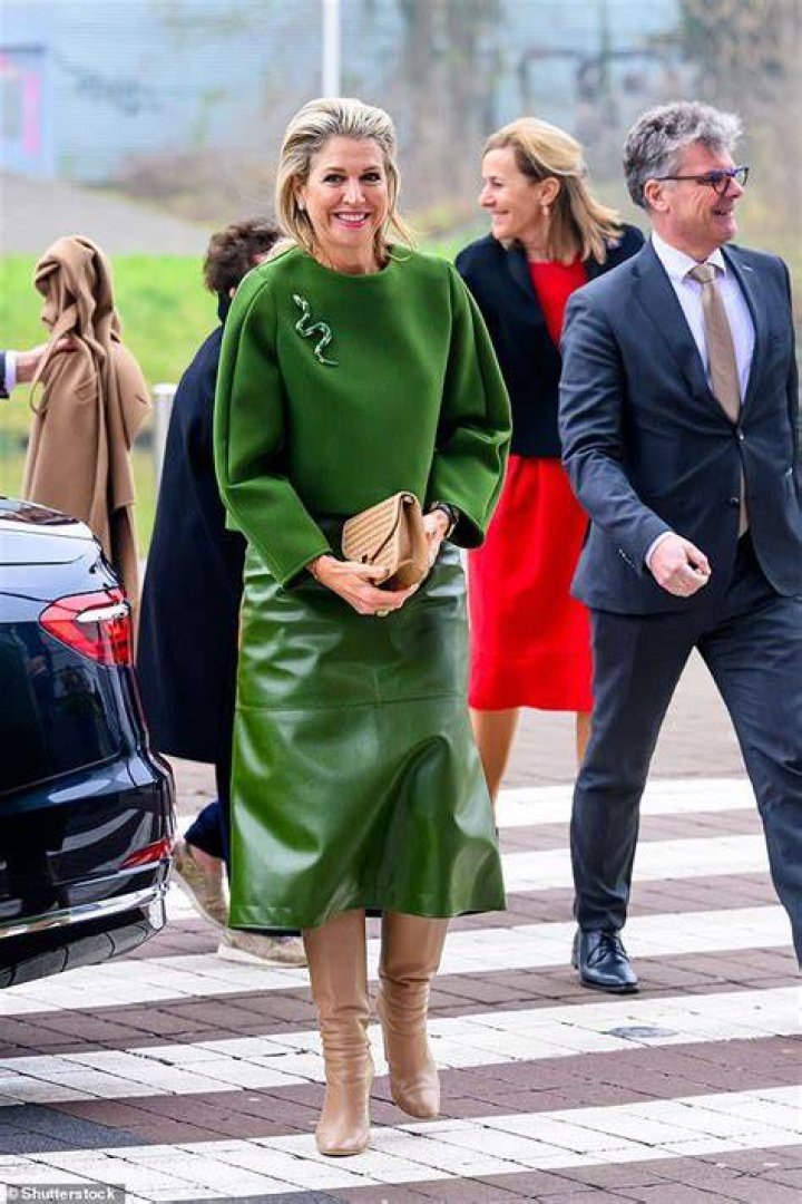 Queen Maxima walking in leather culottes