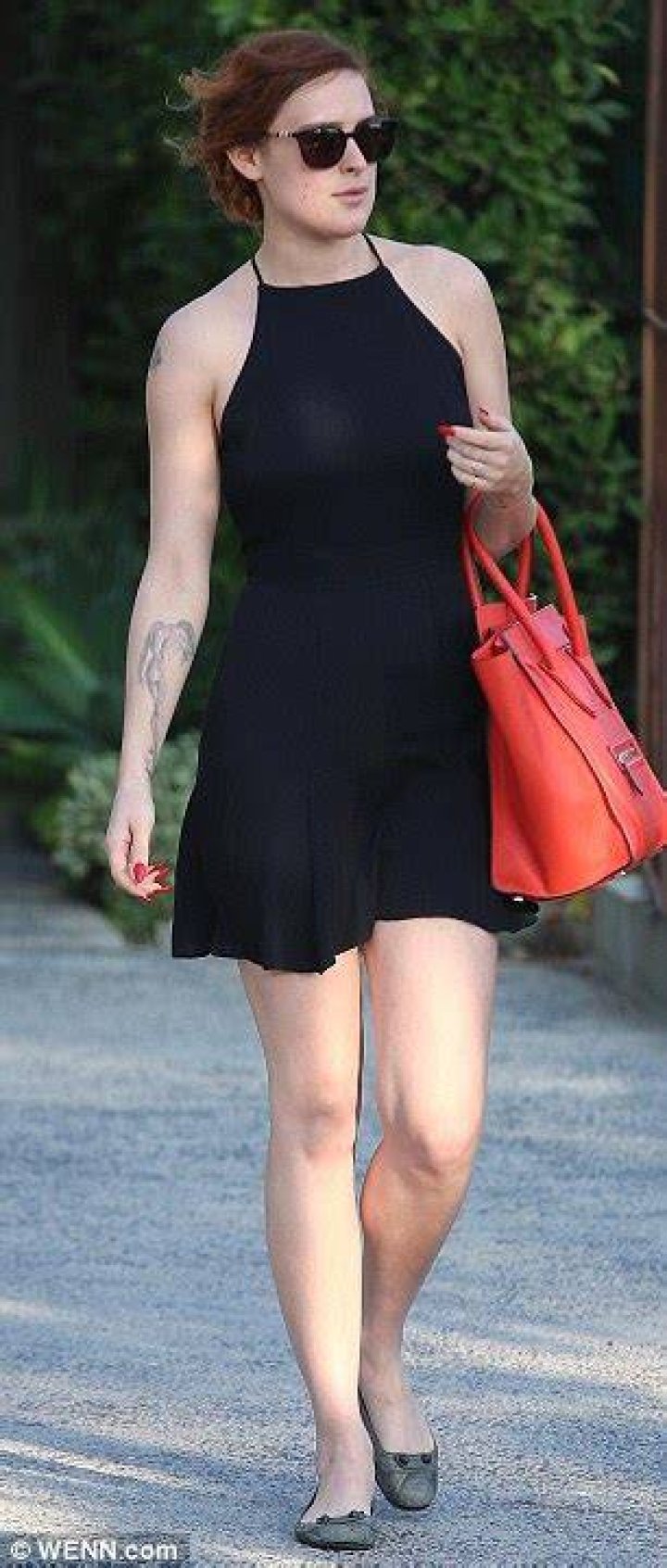 Rumer showed off her sensational figure in a yellow bikini