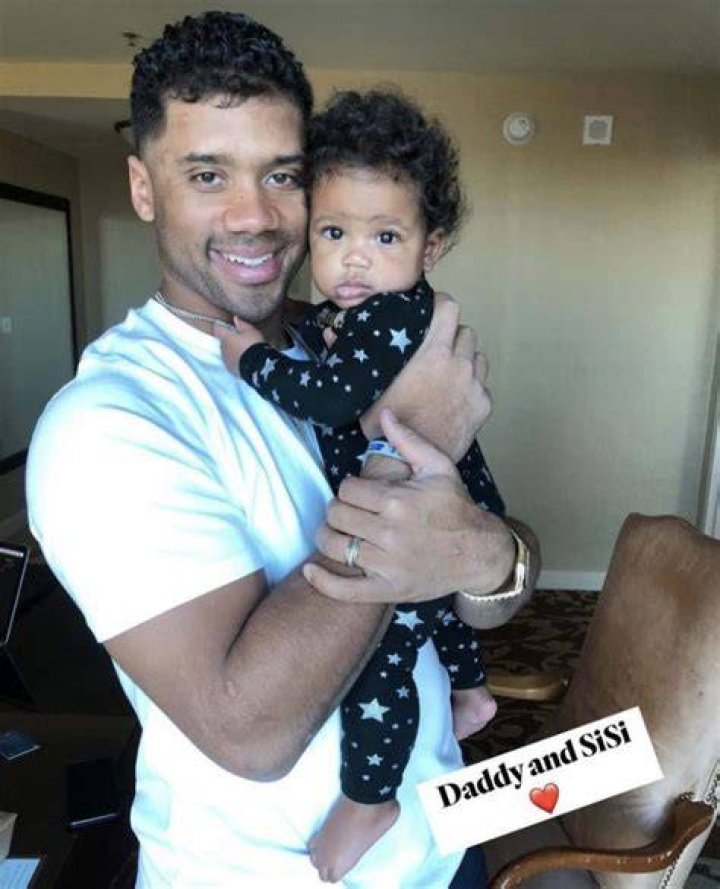 Russell Wilson poses with his family Sienna, Future, Win and Ciara following an introductory press conference on March 16, 2022 in Englewood, Colorado