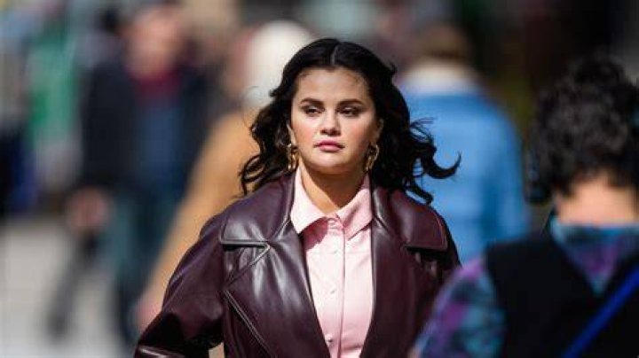 Selena Gomez bloody in a white top walked out by cops