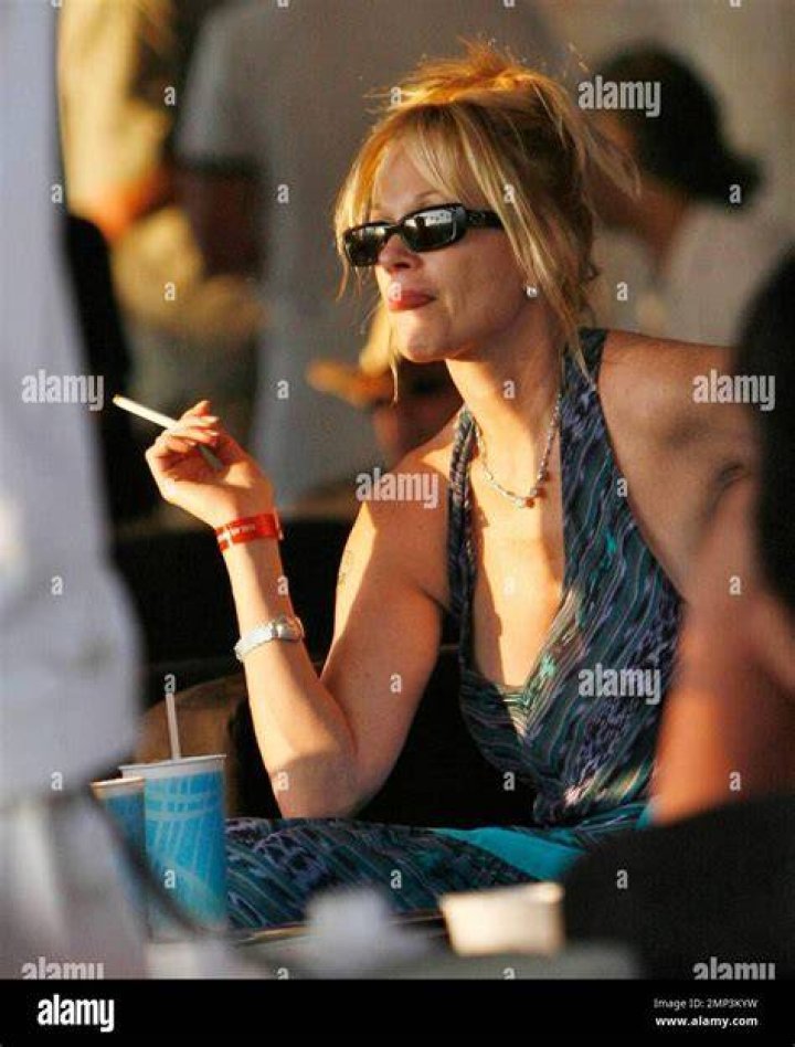 Smoke break: Melanie Griffith, 64, was spotted taking a puff on a cigarette on Wednesday before she went to visit a friend in Los Angeles