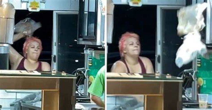 The enraged customer destroying McDonald's property and throwing objects at the staff | Photo: