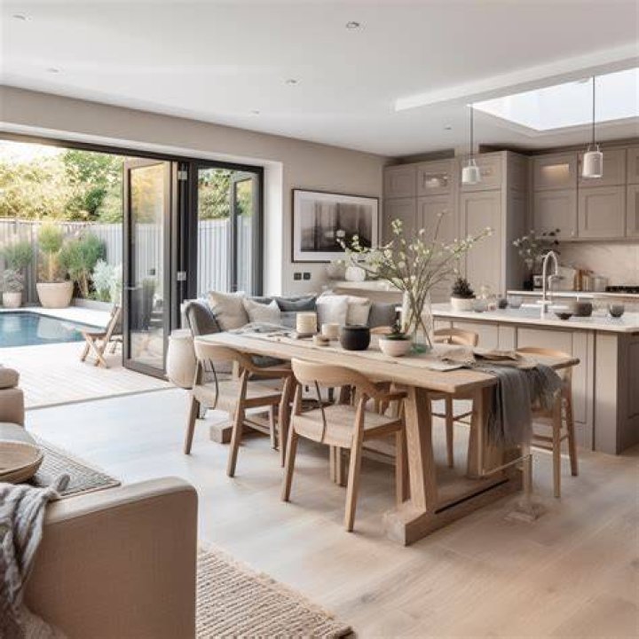 The kitchen area and living room are separated by a wall before the renovation. | Source: