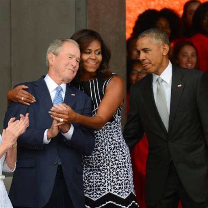 The Obamas stood together with their dogs