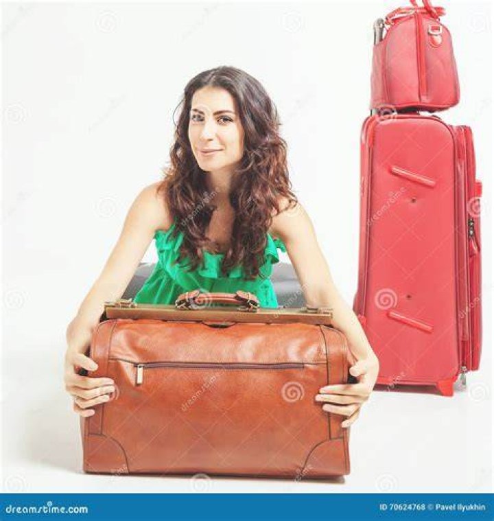 woman holding luggage