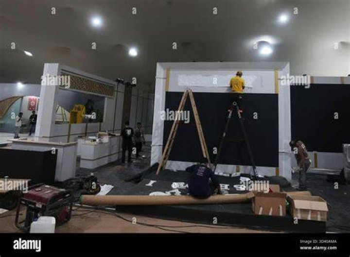 Workers prepare the reception venue of Jennifer Gates' wedding, which will take place on Saturday afternoon